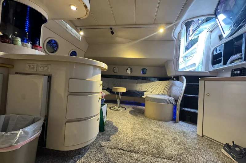 Slide: The Image of Luxurious interior of a 1996 Sea Ray 500 Sedan Bridge yacht with modern amenities. - 19