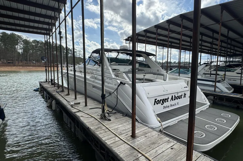 Slide: The Image of 1996 Sea Ray 500 Sedan Bridge docked, "Forget About It" nameplate, Delray Beach, FL. - 2