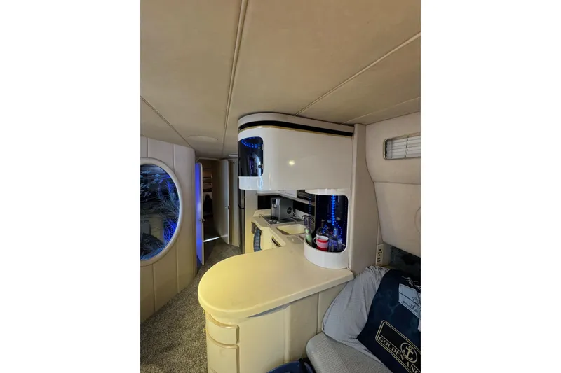 Slide: The Image of Interior of 1996 Sea Ray 500 Sedan Bridge yacht with modern amenities. - 21