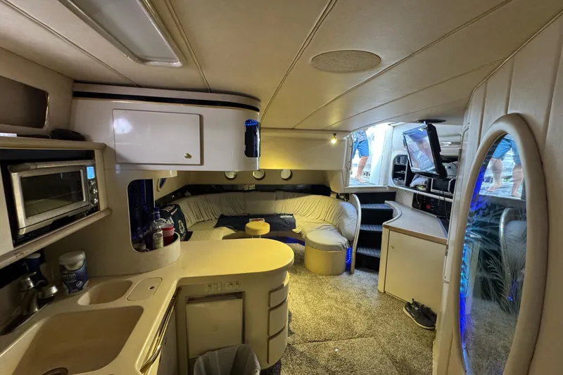 Slide: The Image of Interior of a 1996 Sea Ray 500 Sedan Bridge yacht with modern amenities. - 22