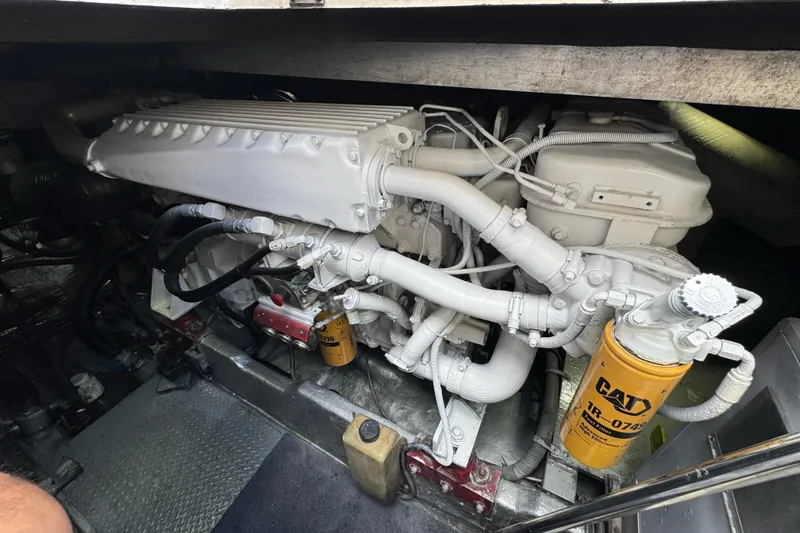 Slide: The Image of Engine compartment of a 1996 Sea Ray 500 Sedan Bridge with CAT filter visible. - 32