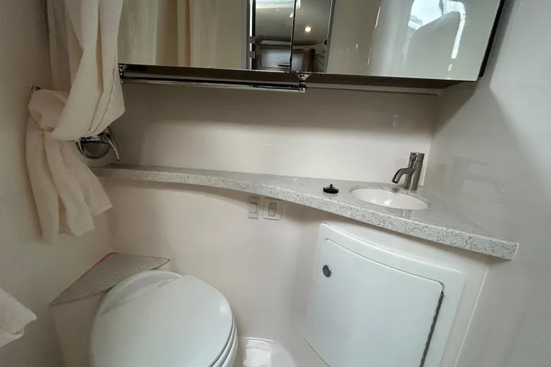 Slide: The Image of 2017 Regal 28 Express bathroom with sink, mirror, and toilet. - 14