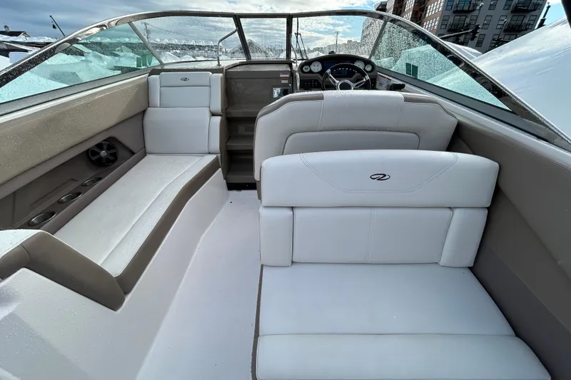 Slide: The Image of 2017 Regal 28 Express boat interior with white seating and modern dashboard. - 8