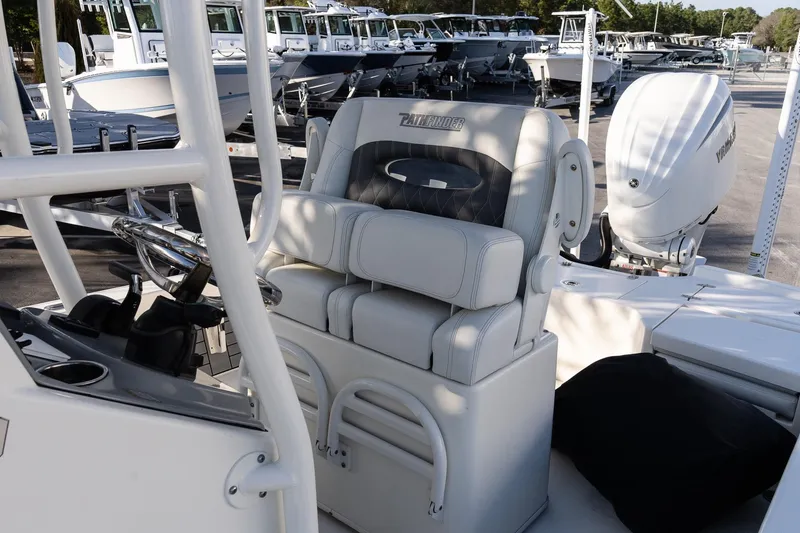 Slide: The Image of 2024 Pathfinder 2500 Hybrid boat interior with steering console and seating. - 10