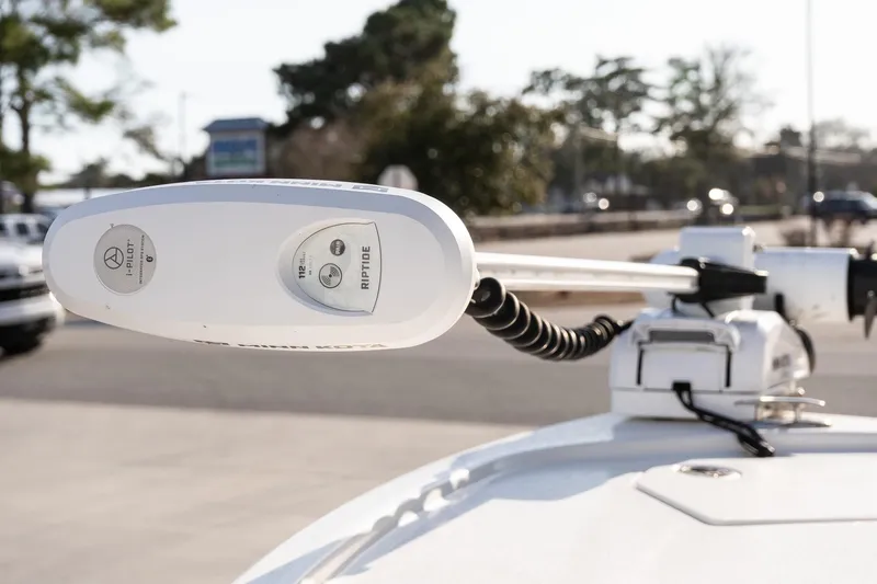 Slide: The Image of 2024 Pathfinder 2500 Hybrid boat with Minn Kota Riptide trolling motor in a parking lot. - 14