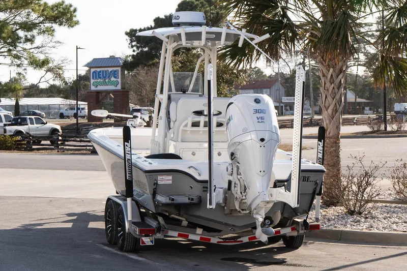 Slide: The Image of 2024 Pathfinder 2500 Hybrid boat on trailer, parked near Neuse Sport Shop. - 3