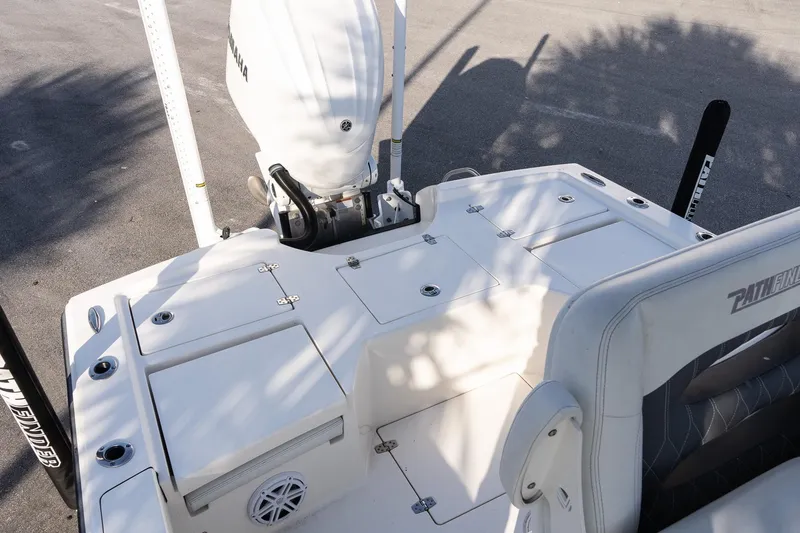 Slide: The Image of 2024 Pathfinder 2500 Hybrid boat deck with Yamaha engine, featuring storage compartments and seating. - 6