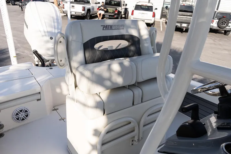 Slide: The Image of 2024 Pathfinder 2500 Hybrid boat interior with cushioned seating and Yamaha engine. - 9