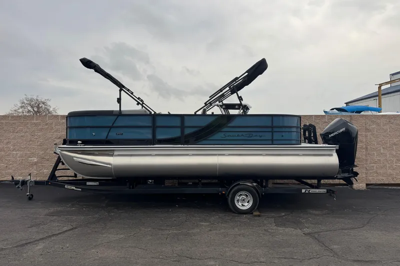 The Image of 2026 South Bay S222E pontoon boat on trailer, parked outdoors. - 0