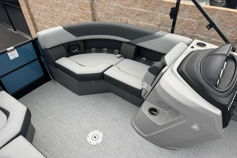 Slide: The Image of 2026 South Bay S222E boat interior with gray seating and modern dashboard design. - 13