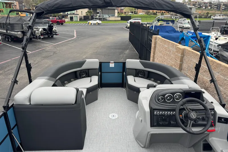 Slide: The Image of 2026 South Bay S222E pontoon boat interior with modern seating and control panel. - 16