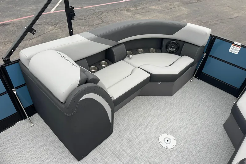 Slide: The Image of 2026 South Bay S222E pontoon boat interior with gray seating and cup holders. - 8