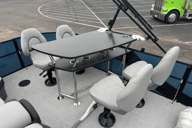 Slide: The Image of 2026 South Bay S222E boat interior with table and four swivel chairs. - 9