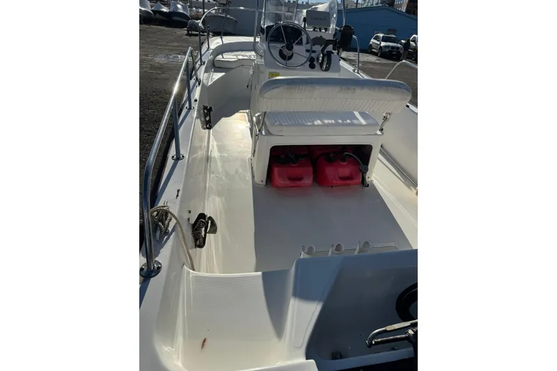 Slide: The Image of 2015 Boston Whaler 170 Montauk boat interior with steering console and seating. - 3