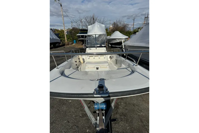 Slide: The Image of 2015 Boston Whaler 170 Montauk boat on trailer, outdoor storage setting. - 5