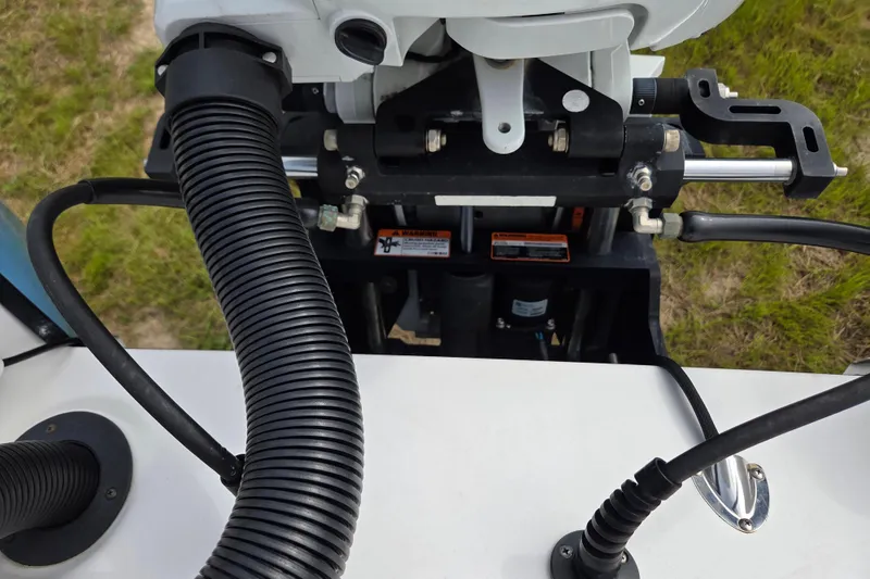 Slide: The Image of Close-up of 2022 Aquasport 244 Bay boat engine components and wiring. - 22