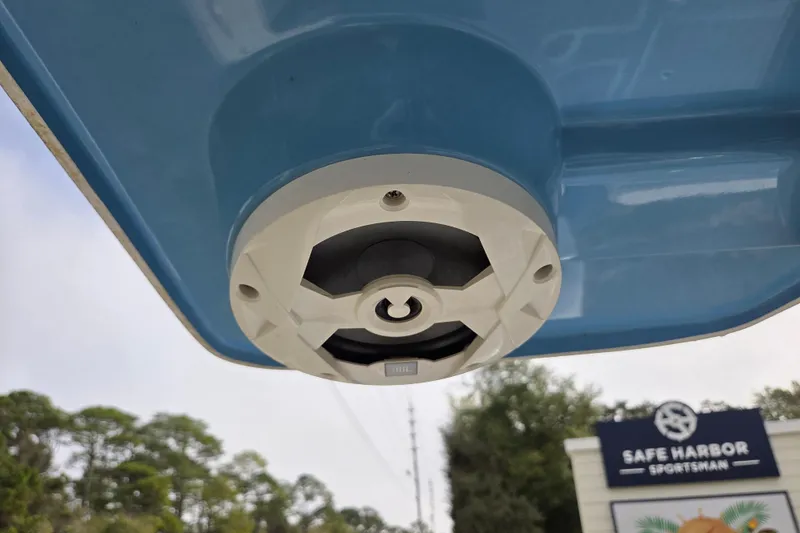 Slide: The Image of 2022 Aquasport 244 Bay boat detail with Safe Harbor Sportsman sign in background. - 30