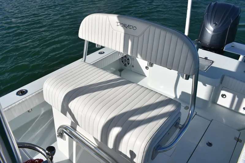 Slide: The Image of 2023 Dorado 25 boat with white cushioned seating and stainless steel frame. - 14