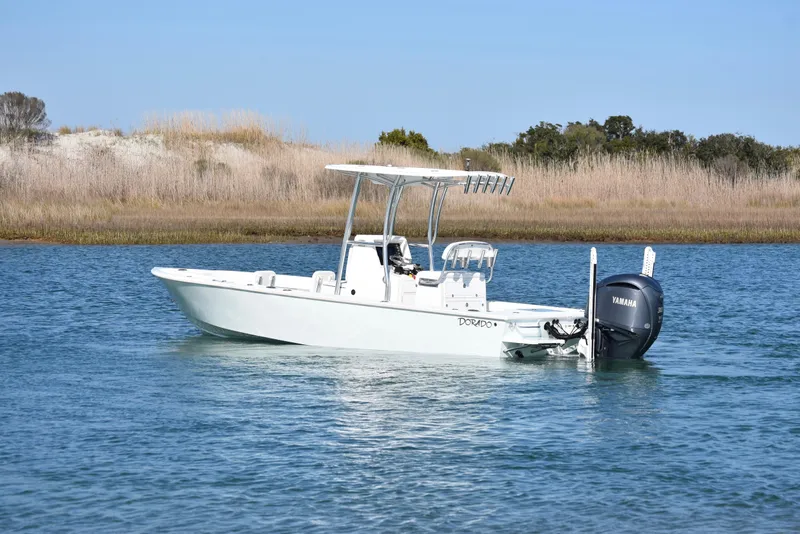 Slide: The Image of 2023 Dorado 25 boat on calm water with Yamaha outboard motor. - 3