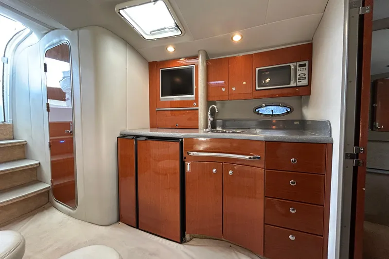 Slide: The Image of Interior of 2005 Formula 40 Performance Cruiser with modern kitchen amenities. - 10