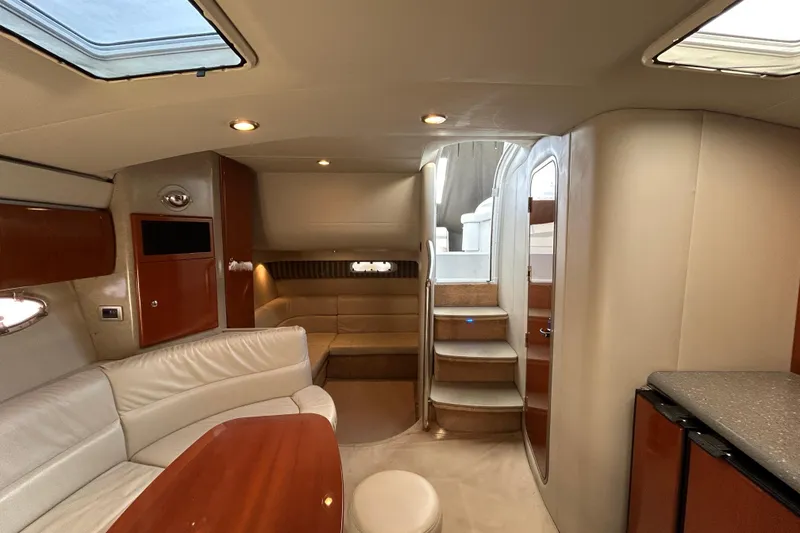 Slide: The Image of Luxurious interior of a 2005 Formula 40 Performance Cruiser with elegant seating and cabinetry. - 11