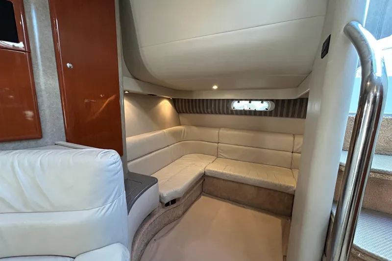 Slide: The Image of Interior of 2005 Formula 40 Performance Cruiser with beige seating and wooden cabinetry. - 12