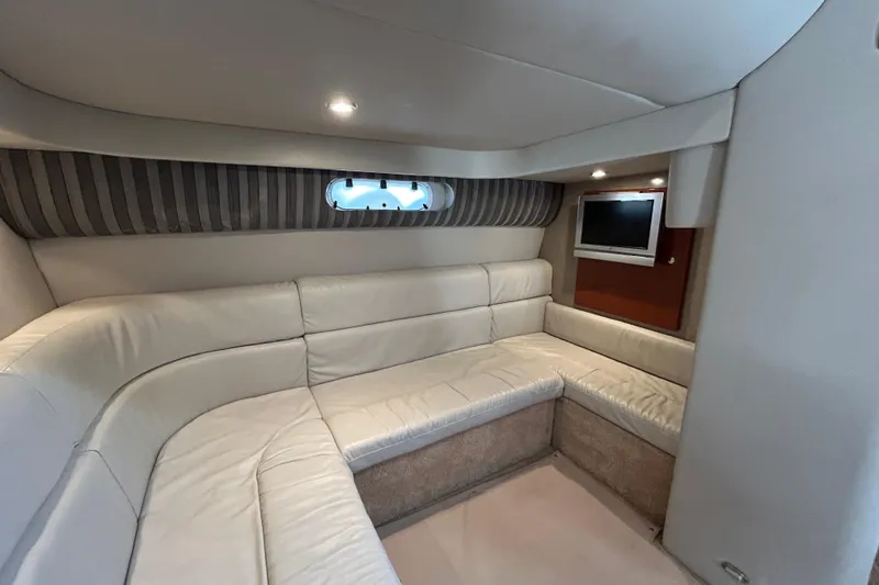 Slide: The Image of Luxurious interior of 2005 Formula 40 Performance Cruiser with plush seating and TV. - 13