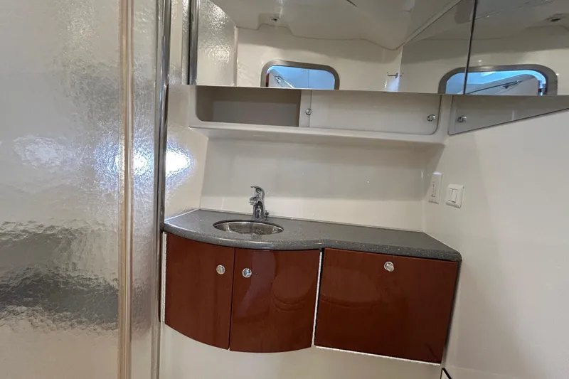 Slide: The Image of 2005 Formula 40 Performance Cruiser bathroom with sleek sink and wooden cabinetry. - 15