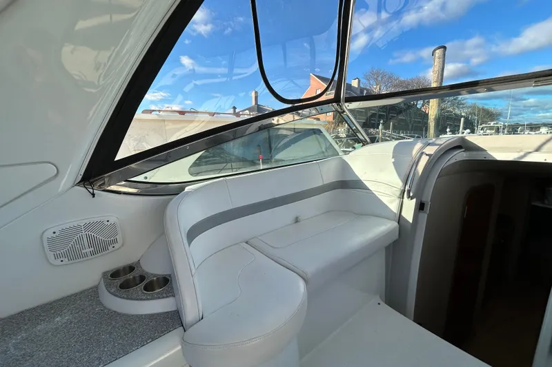 Slide: The Image of 2005 Formula 40 Performance Cruiser interior with white seating and cup holders, under a clear blue sky. - 4