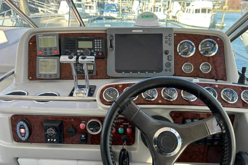 Slide: The Image of 2005 Formula 40 Performance Cruiser dashboard with navigation instruments and steering wheel. - 6