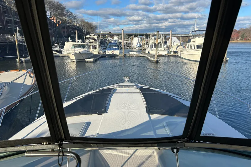 Slide: The Image of View from a 2005 Formula 40 Performance Cruiser at a marina, surrounded by boats. - 7