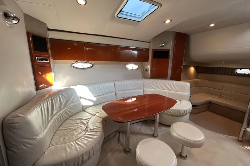 Slide: The Image of Luxurious interior of 2005 Formula 40 Performance Cruiser with leather seating and wooden table. - 9
