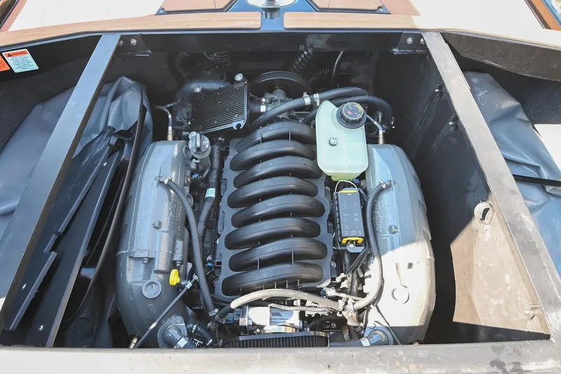 Slide: The Image of 2023 Axis A225 engine compartment showcasing a powerful, modern engine design. - 43