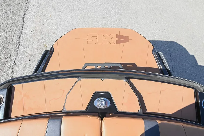 Slide: The Image of 2023 Axis A225 boat deck with tan upholstery and sleek design. - 13