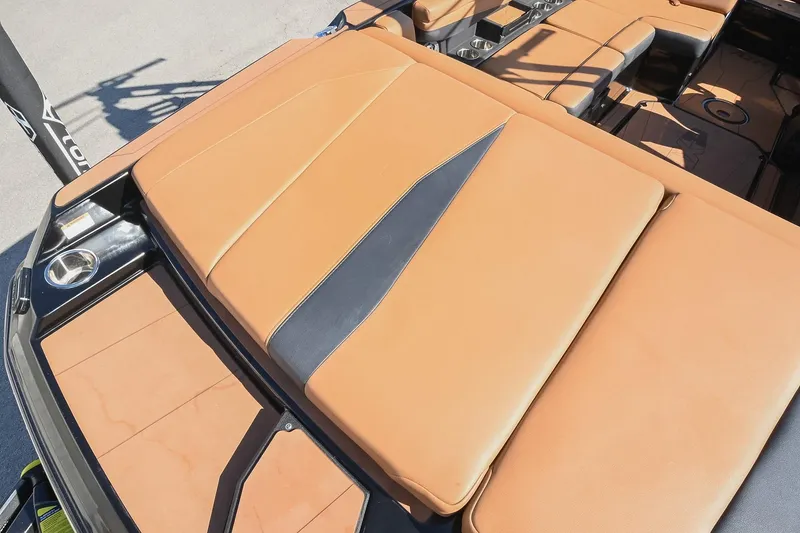 Slide: The Image of 2023 Axis A225 boat with tan leather seating and sleek design. - 16