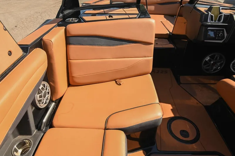 Slide: The Image of 2023 Axis A225 boat interior with tan leather seating and modern design elements. - 28