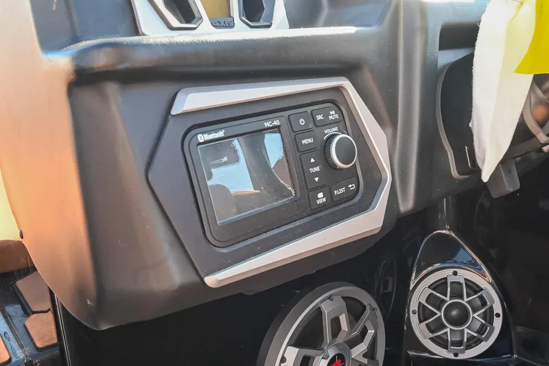 Slide: The Image of 2023 Axis A225 dashboard with Bluetooth audio controls and speaker system. - 33