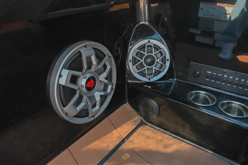 Slide: The Image of 2023 Axis A225 boat interior with premium audio speakers and control panel. - 34