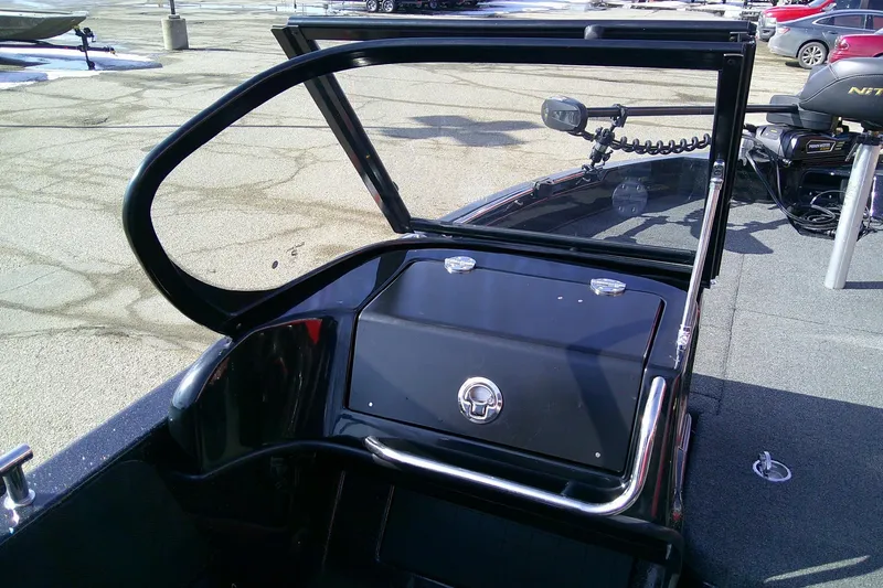 Slide: The Image of 2018 Nitro ZV18 boat interior with open windshield and control panel. - 12
