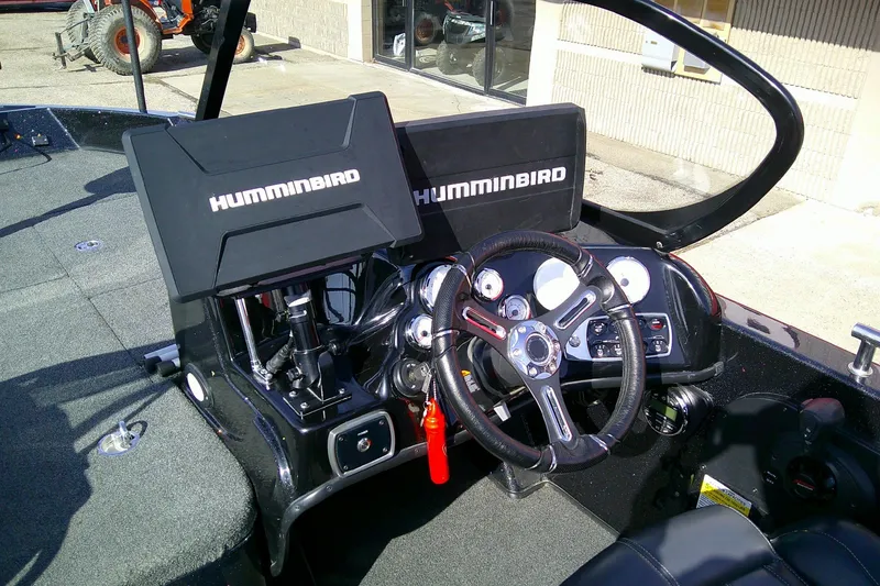 Slide: The Image of Cockpit of 2018 Nitro ZV18 boat with Humminbird electronics and steering wheel. - 13