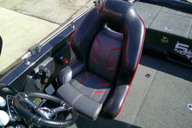 Slide: The Image of 2018 Nitro ZV18 boat interior with black and red captain's seat. - 15