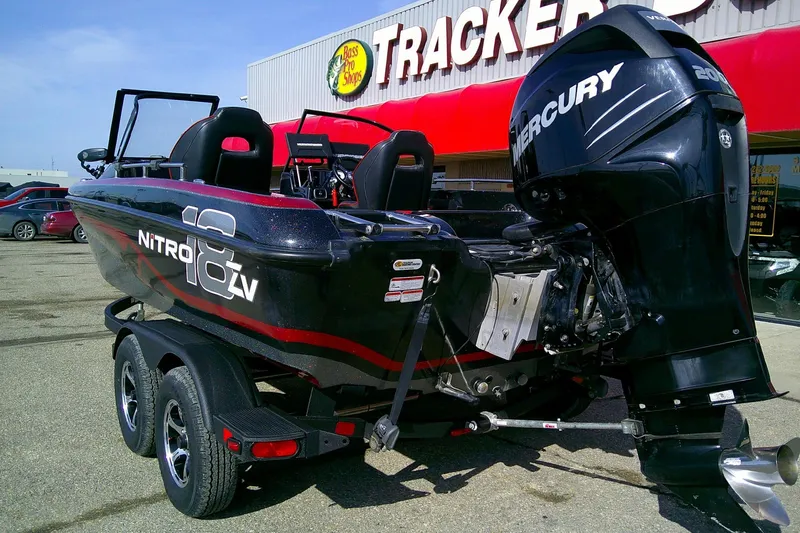 Slide: The Image of 2018 Nitro ZV18 boat with Mercury engine parked outside Bass Pro Shops. - 2