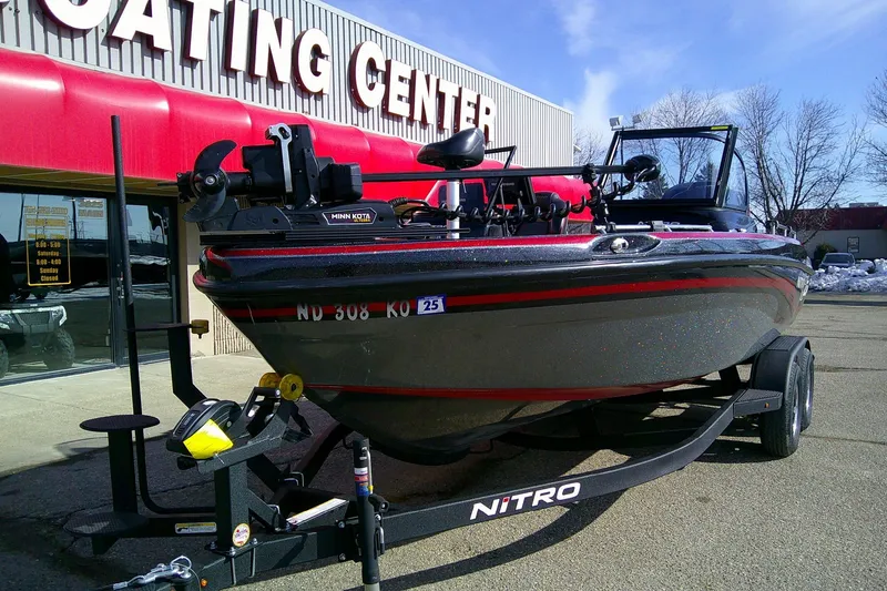 Slide: The Image of 2018 Nitro ZV18 boat on trailer outside a boating center. - 3
