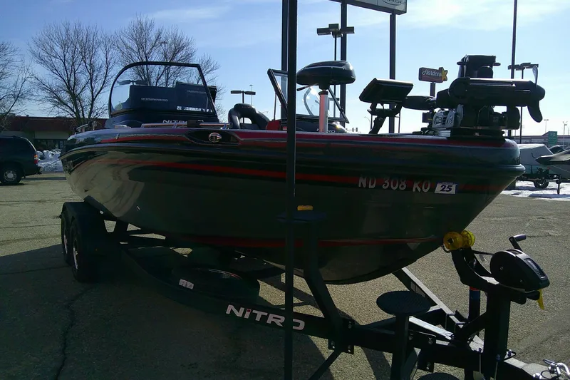 Slide: The Image of 2018 Nitro ZV18 boat on trailer in parking lot, sunny day. - 5