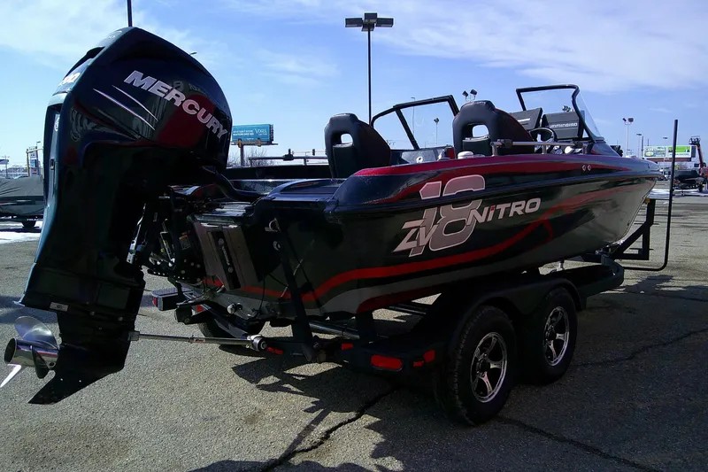 Slide: The Image of 2018 Nitro ZV18 boat with Mercury engine on trailer in parking lot. - 6