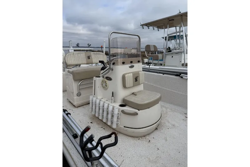 Slide: The Image of 2018 Carolina Skiff 258 DLV boat interior with seating and rod holders. - 3