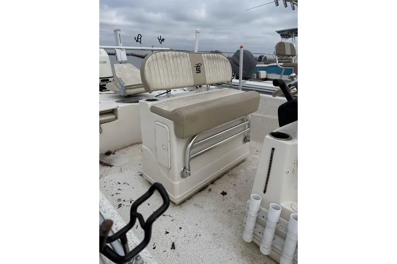 Slide: The Image of 2018 Carolina Skiff 258 DLV boat interior with seating and rod holders. - 4