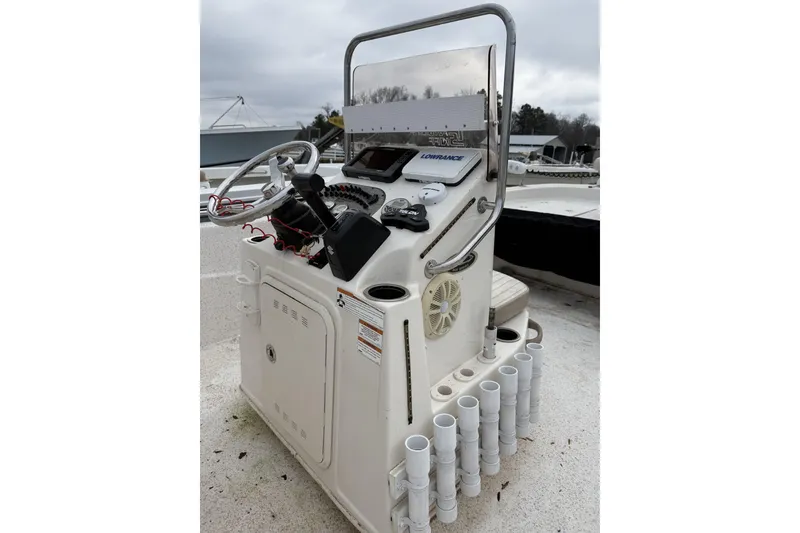 Slide: The Image of 2018 Carolina Skiff 258 DLV boat console with steering wheel and controls. - 6