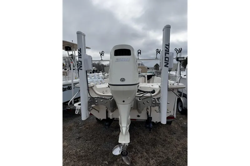Slide: The Image of 2018 Carolina Skiff 258 DLV boat with outboard motor and Talon anchors. - 8