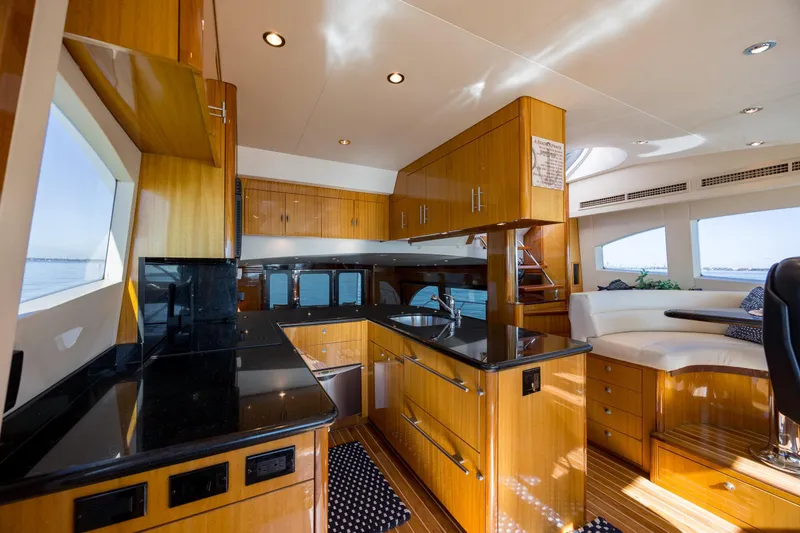 Slide: The Image of Luxurious 2007 Hatteras 64 Motor Yacht interior with sleek wood cabinetry and modern design. - 22